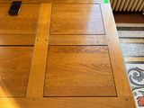 a wooden table with a cell phone on top of it