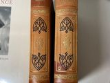 two books sitting on a table next to each other