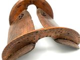 pair of old wooden shoes on a white background
