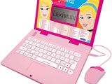 pink laptop with a barbie doll on the screen and a mouse in front of it