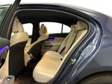 the interior of a car with the door open and the driver ' s seat down