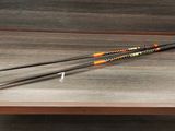 a pair of ski poles sitting on a wooden bench