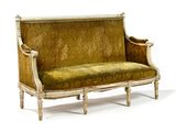 a couch that is sitting on a white surface