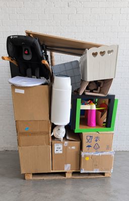 a pile of boxes and other items on the floor