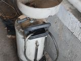a dirty toilet sitting next to a dirty sink