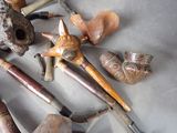 a lot of different types of pipe smokings on a table