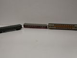 three toy trains sitting on a table next to each other