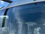a close up of a car ' s windshield with the sun shining through the windshield