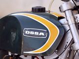 a close up of a motorcycle parked on the street