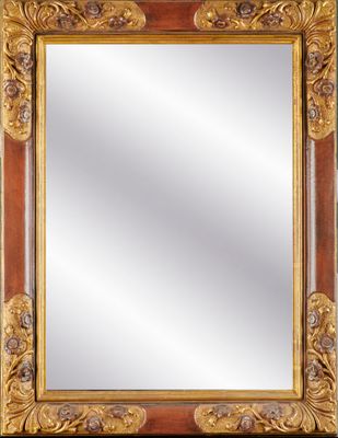 un miroir au cadre doré ouvragé sur fond noir