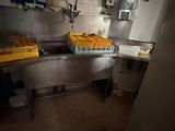 an image of a kitchen with a bunch of oranges in a basket