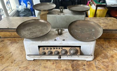 three pans sitting on top of an old stove