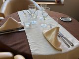 a table set with place settings and place settings on the table