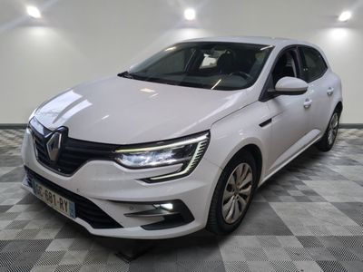 a white car is parked in a room with a checkered floor