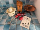 a kitchen counter with a blender, mixer, and other kitchen items on it