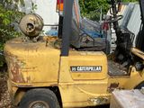 a forklift truck that is parked in the yard