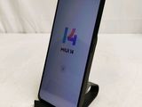 the back of a black phone with a multi - colored logo on it