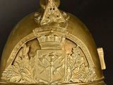 a gold helmet with a crown on top of it