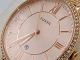 a close up of a watch on display in a box