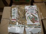 two packages of food sitting on top of a cardboard box