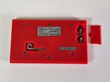 an image of a red electronic device on a white surface