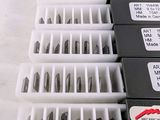 a lot of different types of screws in the box