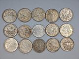a close up of a bunch of coins sitting on top of a table