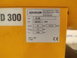 a close up of a yellow machine with a number on it