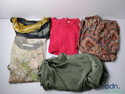 a lot of clothes that are laying out on a table