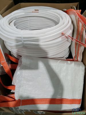 a box with a bunch of white hoses inside of it