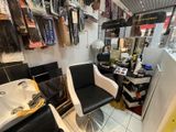 a room with a sink and a chair in it