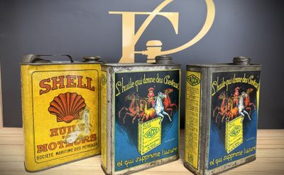 three tins that are sitting next to each other
