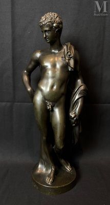 bronze statue of a boy holding a bag and a book