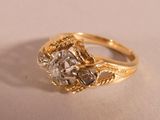 an image of a diamond ring on a white surface