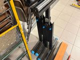 many chairs and ladders in a room with many different types of chairs