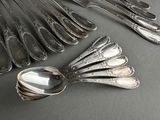 a lot of silver spoons and spoon spoons on a table