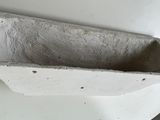 a concrete planter sitting on top of a white plate