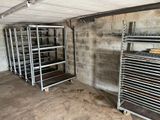 a room with a bunch of racks and shelves in it