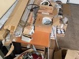many boxes of assorted items sitting on the floor