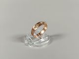 a close up of a ring with a diamond on top of it