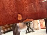 a reflection of a person in a mirror on a table