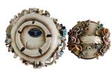pair of antique porcelain candlesticks in the form of flowers and leaves
