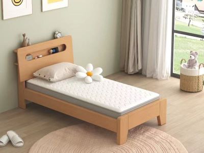 a bed with a wooden headboard and a white pillow on it