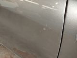 a close up of a car door handle with a sticker on it