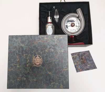a box that has a bottle and a spoon in it