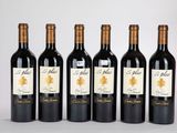 quatre bouteilles de vin sont alignées