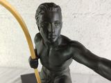 a bronze statue of a boy with a bow and arrow
