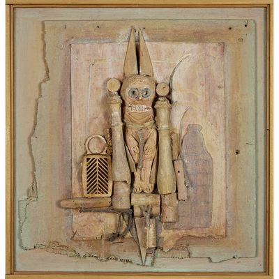 an image of a wooden carving of a man with a hat and a knife