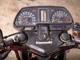 a close up of a motorcycle with a speedometer and gauges on it