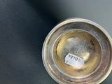 an image of a silver cup with a sticker on it